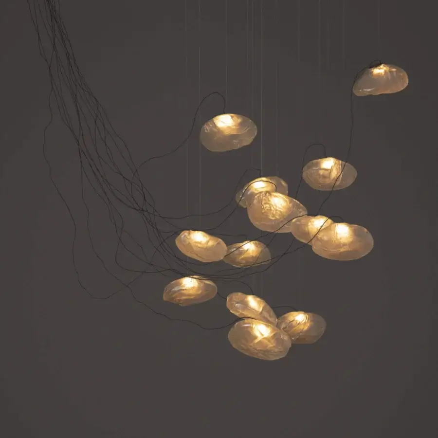 Captivating Bocci 73 sculptural cable suspension lamp with pale amber blown glass and dark braided metal coaxial cable