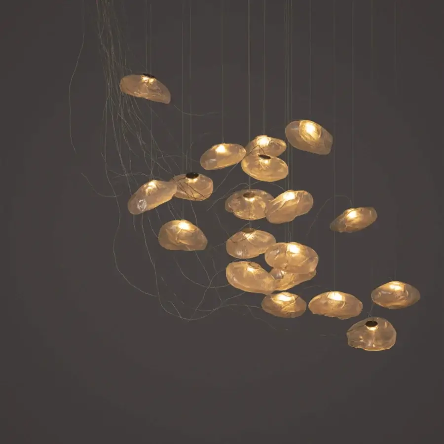 Exclusive Bocci 73 sculptural cable suspension lamp with warm amber blown glass and textured surface
