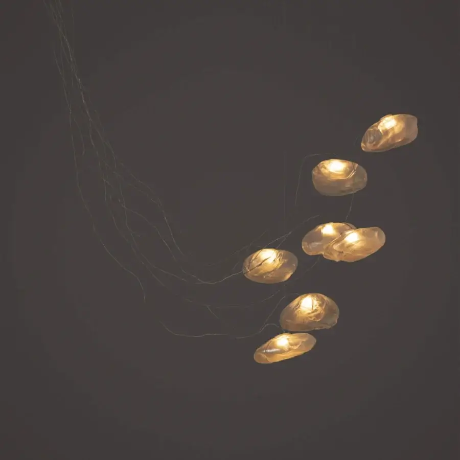 Refined Bocci 73 sculptural cable suspension lamp with seven organically shaped translucent glass shades and braided metal coaxial cable