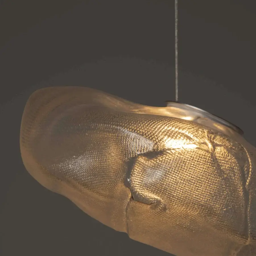 Captivating Bocci 73 suspension lamp with hand-blown glass pendant nestled within folded ceramic, exhibiting a warm golden finish