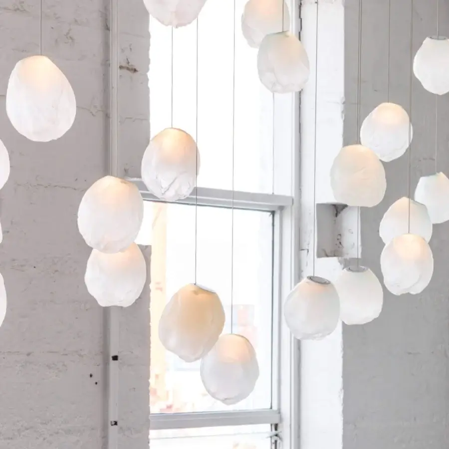 Superior Bocci 73V single suspension lamp crafted in translucent off-white glass with a sleek braided metal coaxial cable and brushed nickel canopy