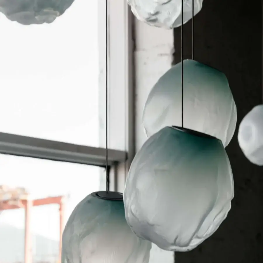 Distinguished Bocci 73V single suspension lamp in muted teal glass with braided metal coaxial cable and brushed nickel canopy