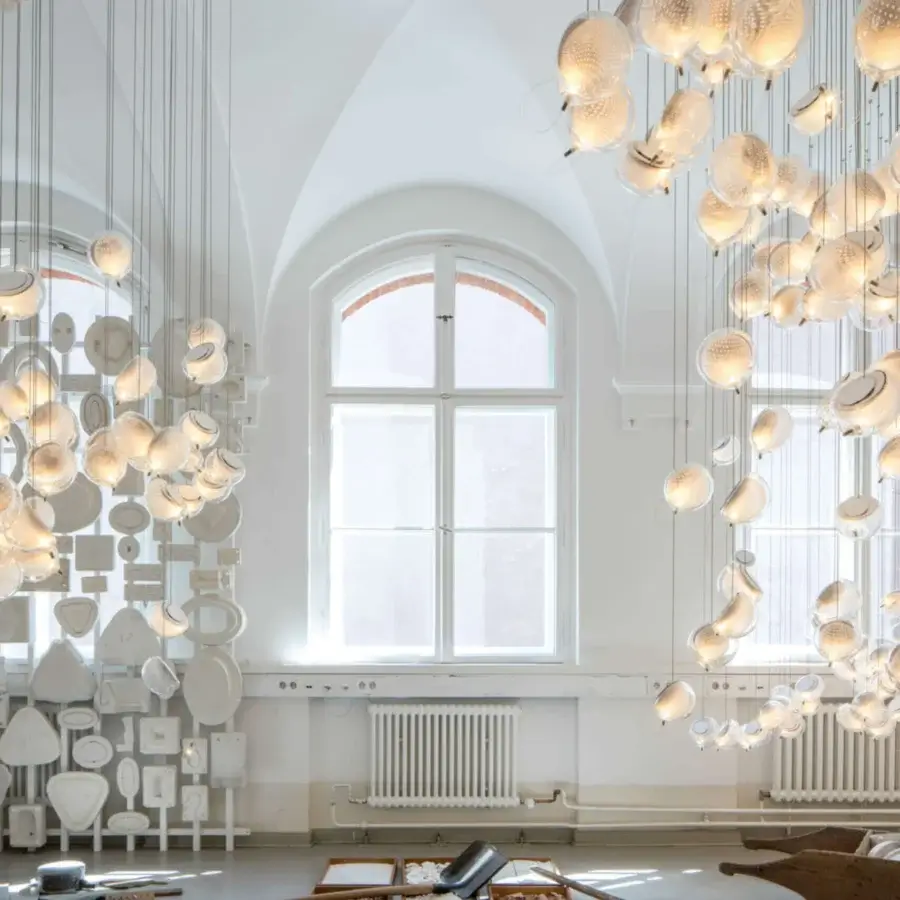 Luxury Bocci 76 Single Suspension Lamp with translucent glass sphere and light-colored metal mesh crafted with a satin finish