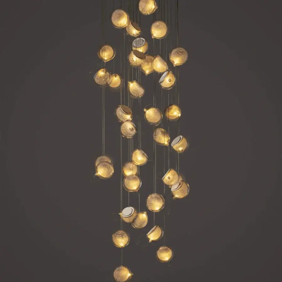 Superior Bocci 76 Random suspension lamp with cascading glass spheres encased in a warm gold toned metal cage and white powder coating