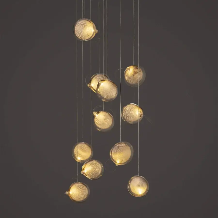 Captivating Bocci 76 Random suspension lamp with hand-blown hot white and clear glass spheres within a copper mesh framework