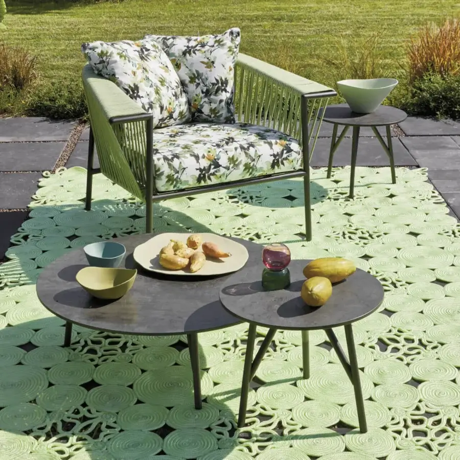 Elegant Roberti Rattan Corolle lounge chair with light green stainless steel frame woven in Oval Trendyrope and floral patterned cushion