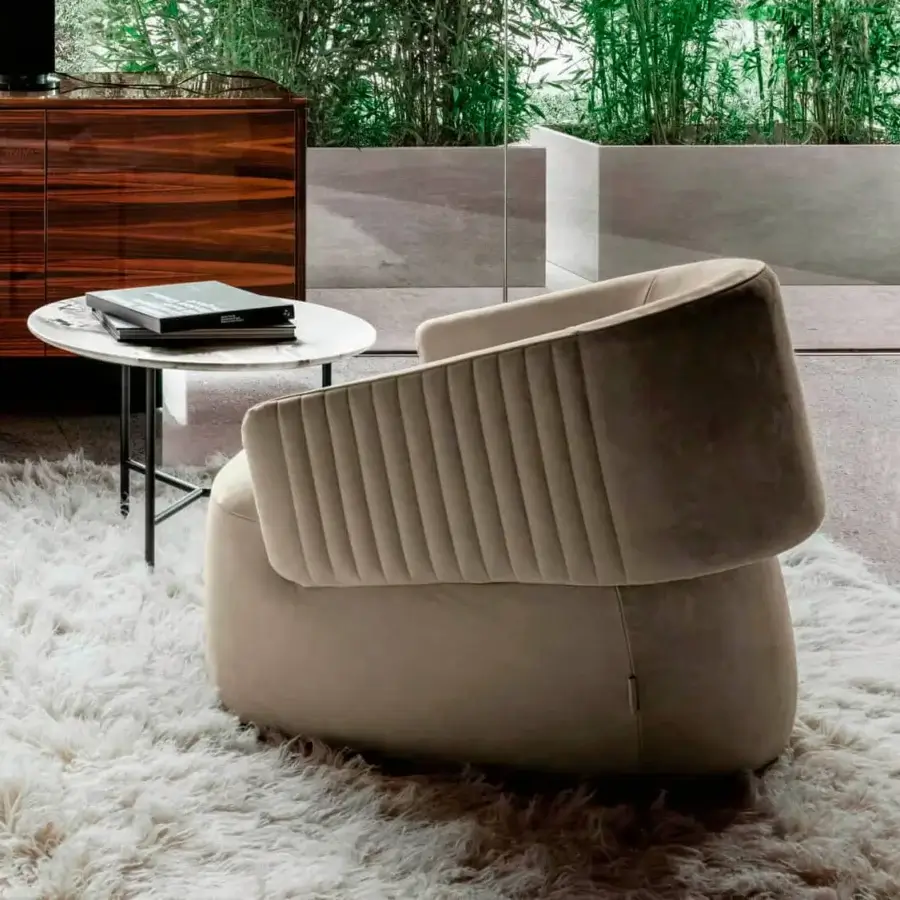 Distinctive 4 Mariani Twibe lounge chair with enveloping volumes upholstered in plush matte beige velvet and pleated detailing