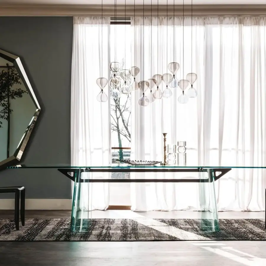 Exceptional Cattelan Italia Sablier suspension lamp in clear glass with thin dark cords creating a scattered form
