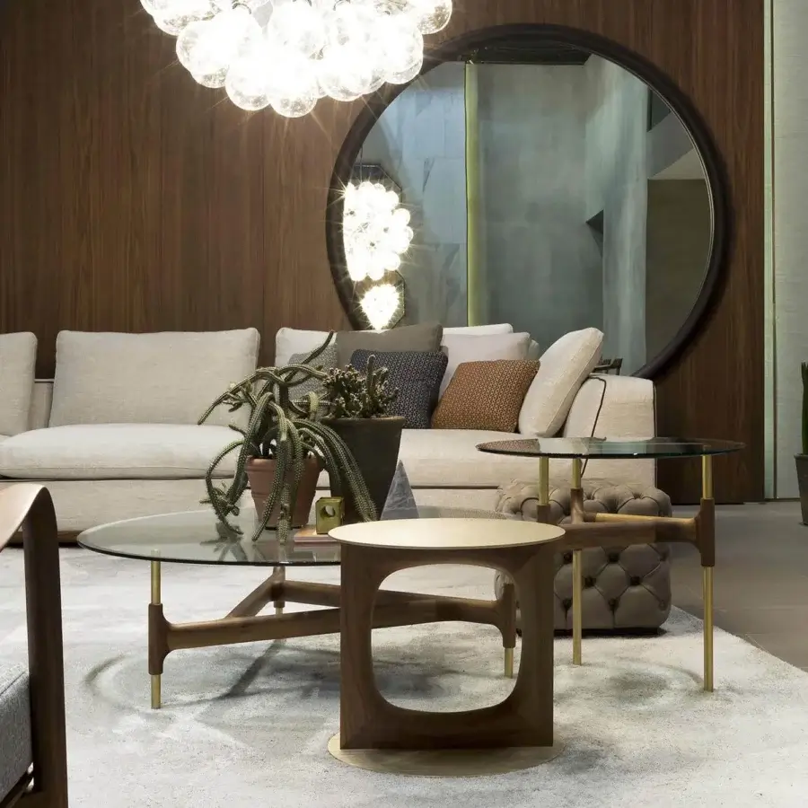 Distinguished Porada Tenco side table with curved lines and negative space crafted in Canaletto walnut with brushed brass metal