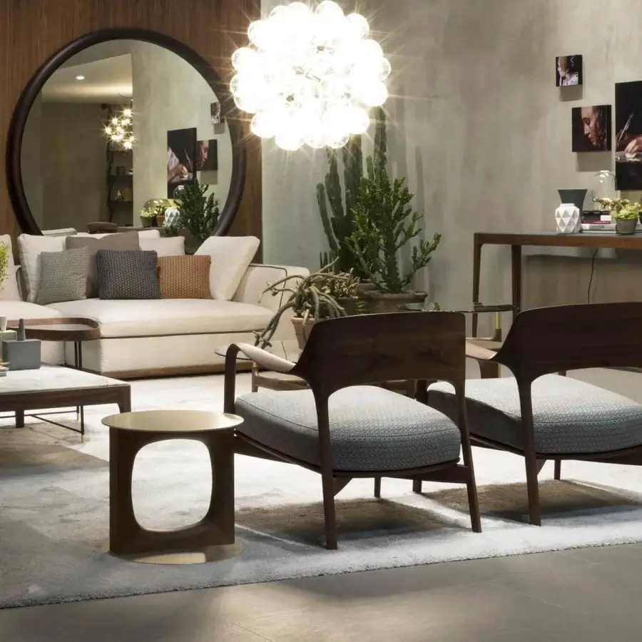 Elegant Porada Tenco side table with cylindrical form and captivating void in Canaletto walnut with brushed brass metal accents