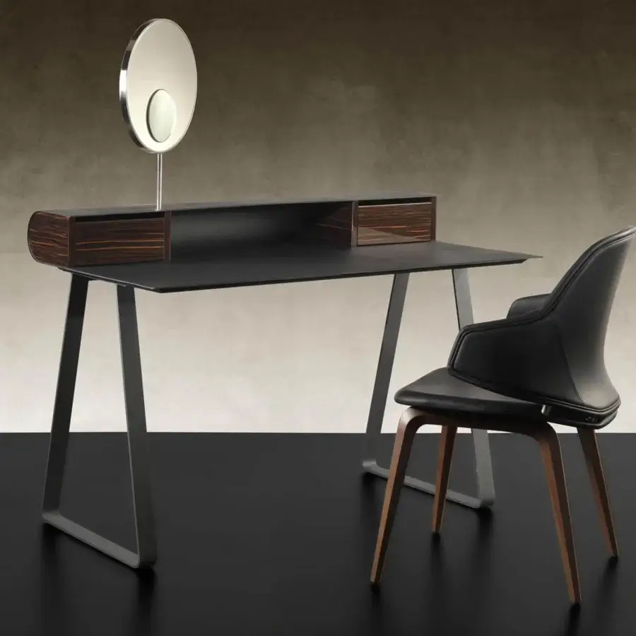 Elegant Reflex Twist desk with dark leather top and horizontally striped wood drawers in matte light gray metal support