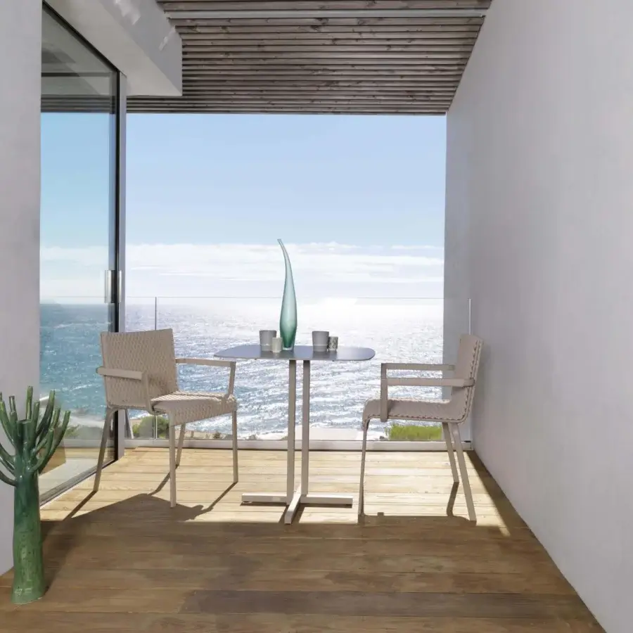 Distinguished Roberti Rattan Key West armchair crafted with light beige Sunrope and powder-coated aluminum structure with a matte finish