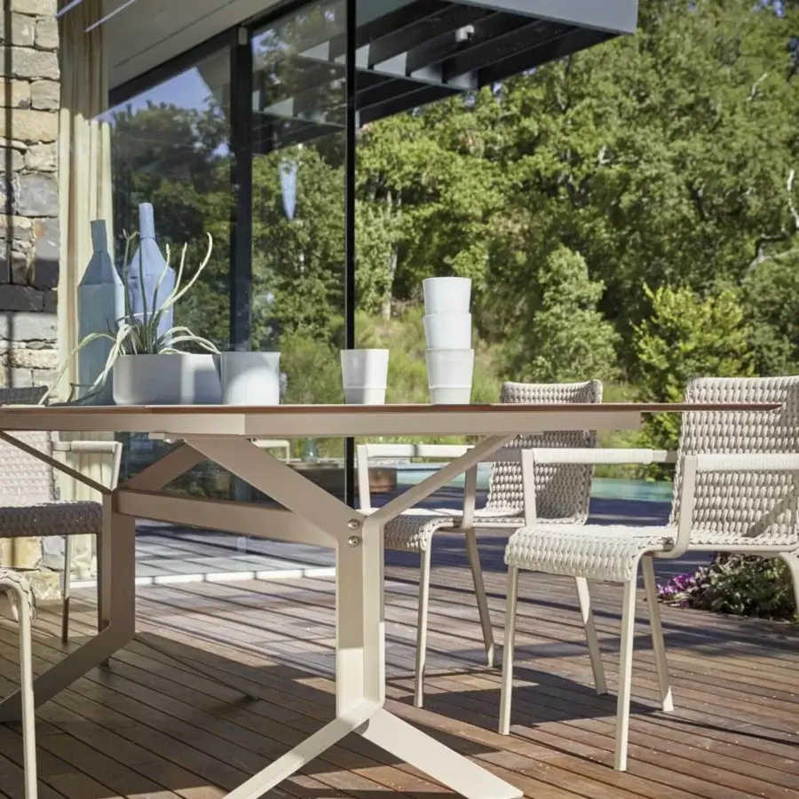 Elegant Roberti Rattan Key West table with powder-coated aluminum structure and medium-brown wood finish HPL top