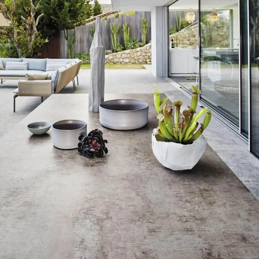Distinguished Roberti Rattan Key West table with durable HPL top in medium gray tones and mottled matte finish