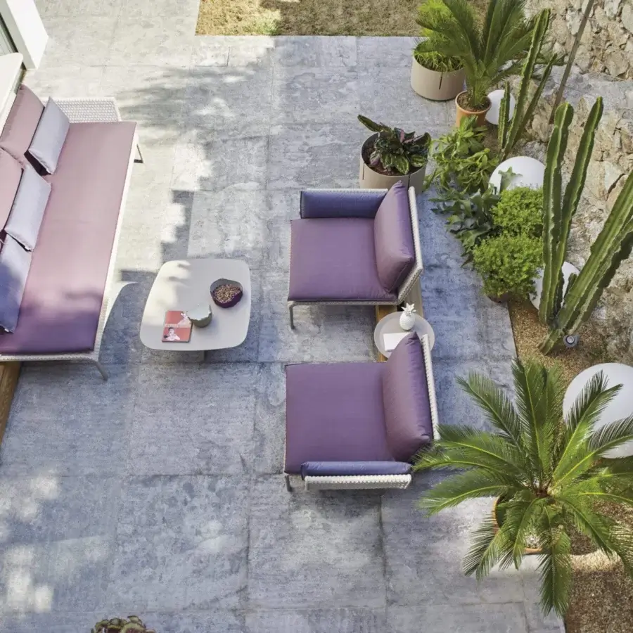 Exclusive Roberti Rattan Key West lounge chair with white Sunrope weaving and comfortable purple cushions crafted with a powder-coated aluminum structure