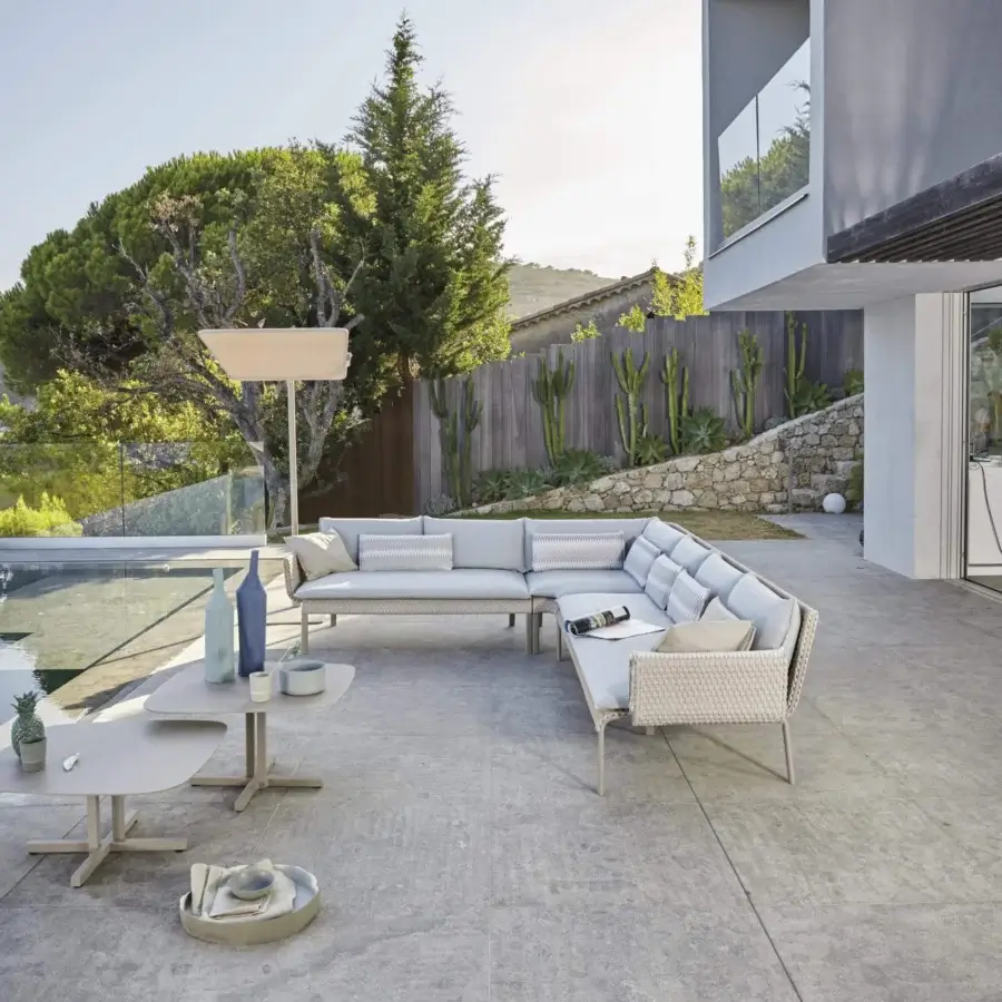 Superior Roberti Rattan Key West sectional with light grey cushions woven in Sunrope over Cipria powder-coated aluminum structure
