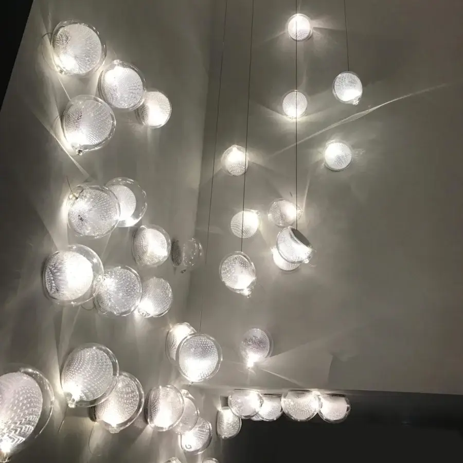 Exceptional Bocci 76 Surface Light lamp with suspended tendrils within white glass and copper mesh