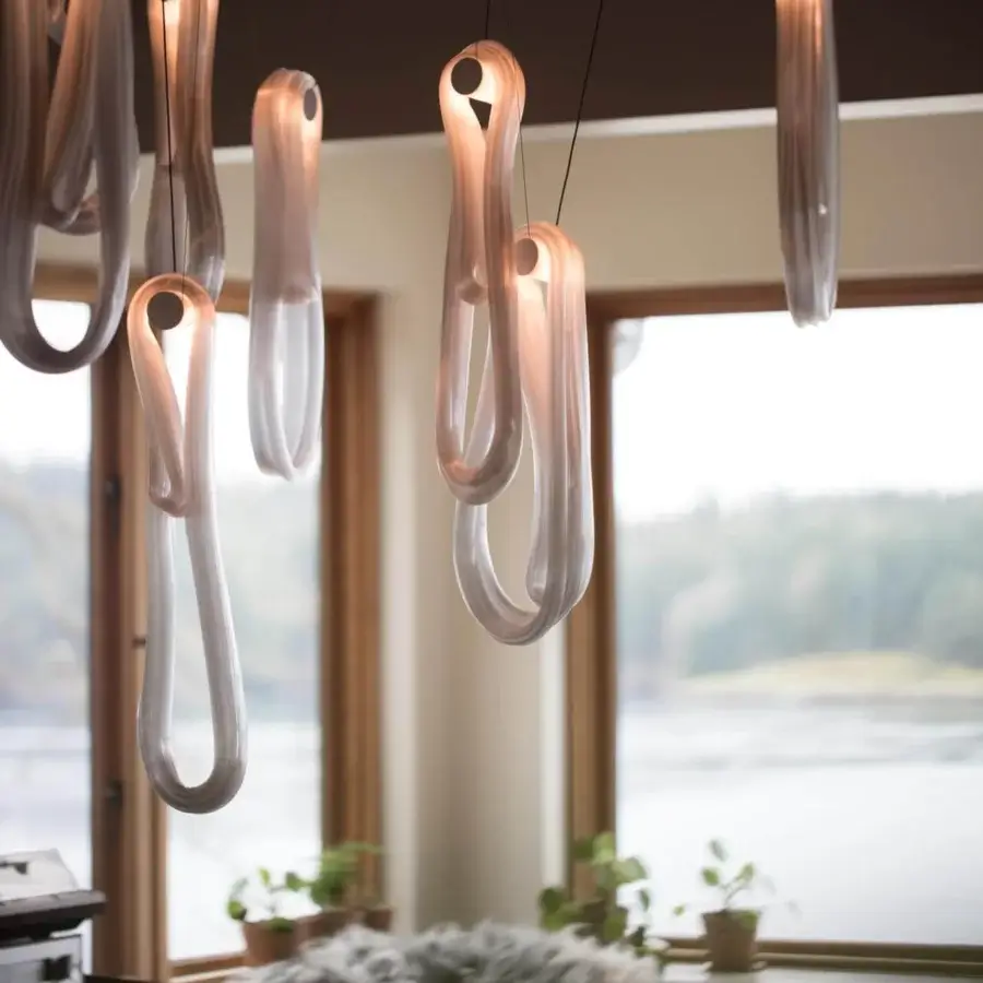 Exceptional Bocci 87 Random Suspension Lamp pendant with continuous pearlescent glass loops emitting a gentle gradient of warm orange light