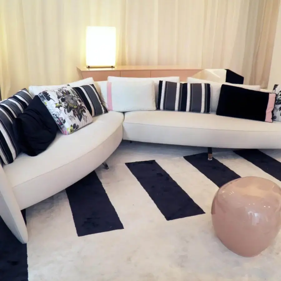 Distinguished Erba Ibiza sofa sectional with white material, black chrome steel feet and cushions in varied patterns