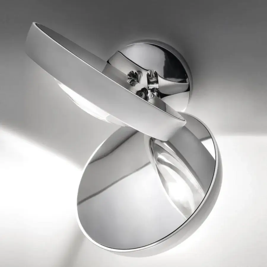 Elegant Lodes Nautilus wall lamp with reflective metal discs connected by a central mounting point, exhibiting a glossy finish