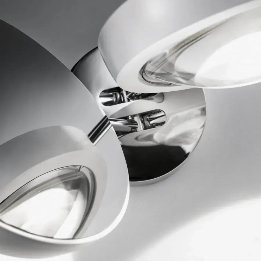 Distinctive Lodes Nautilus wall lamp with a polished metal finish and three connected lamp heads for refined projects