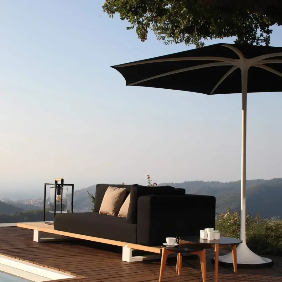 Superior Royal Botania Palma umbrella, a strutless shade with woven black acrylic fiber and white powder-coated aluminum pole