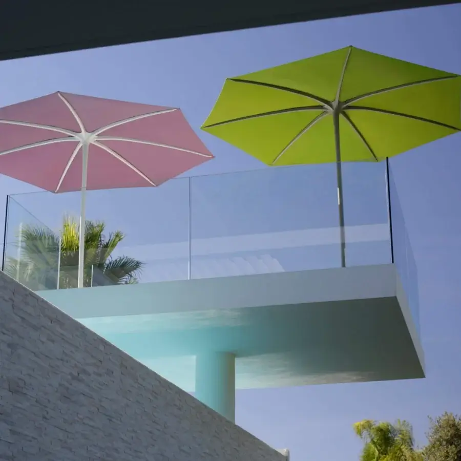Distinguished Royal Botania Palma umbrella, a strutless shade crafted with chartreuse acrylic fiber and white powder-coated aluminum pole