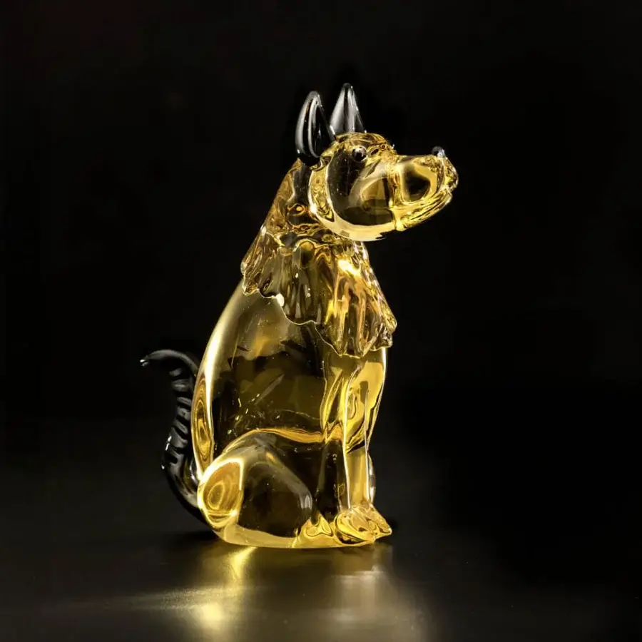 Duccio Di Segna royal dog sculpture, translucent amber glass, stylized canine form with flowing mane and curled tail.