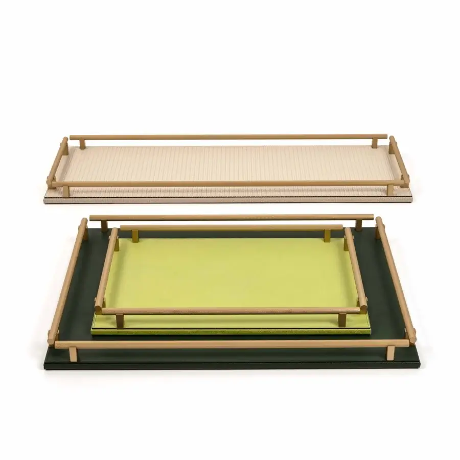 Pinetti Robert Square trays, cream and dark green, ribbed and smooth surfaces with light gold metal handles, layered arrangement.