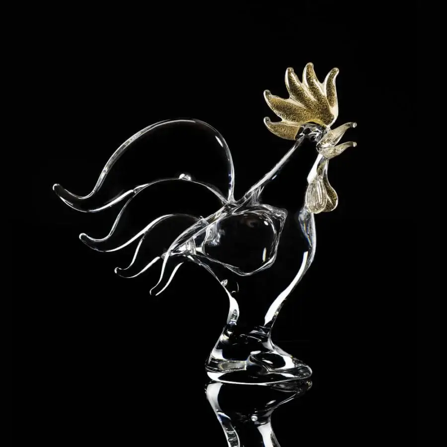 Glass rooster sculpture by Duccio Di Segna, transparent body with gold comb and wattle, on clear pedestal, black background.