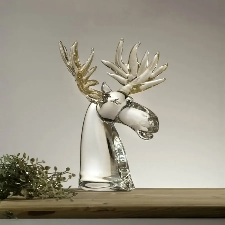 Glass reindeer sculpture by Duccio Di Segna, clear glass, detailed head with branching antlers on a wooden surface.