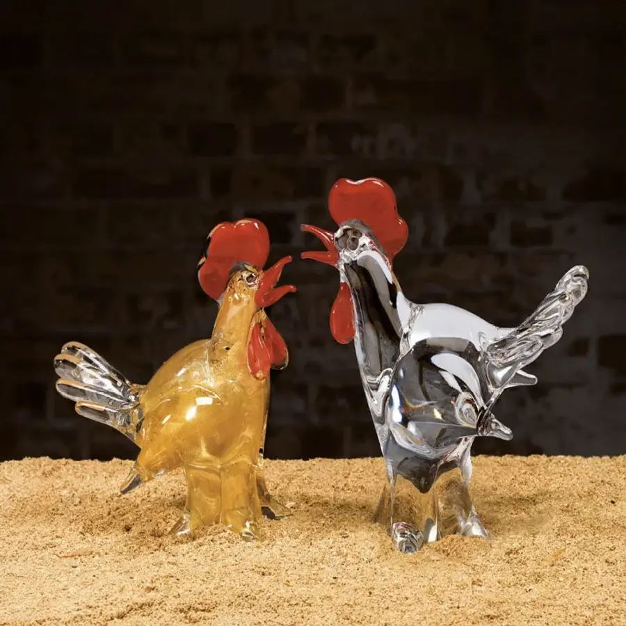 Glass hen and rooster sculptures by Duccio Di Segna on sand, amber and clear glass, stylized elongated forms with red crests.