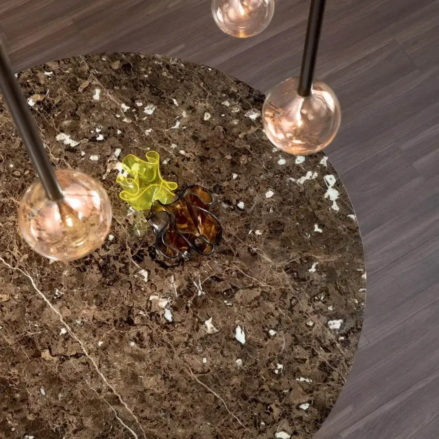 Innovative Bonaldo Art table with a glossy brown ceramic top displaying white veining and a dark metal trapezium base