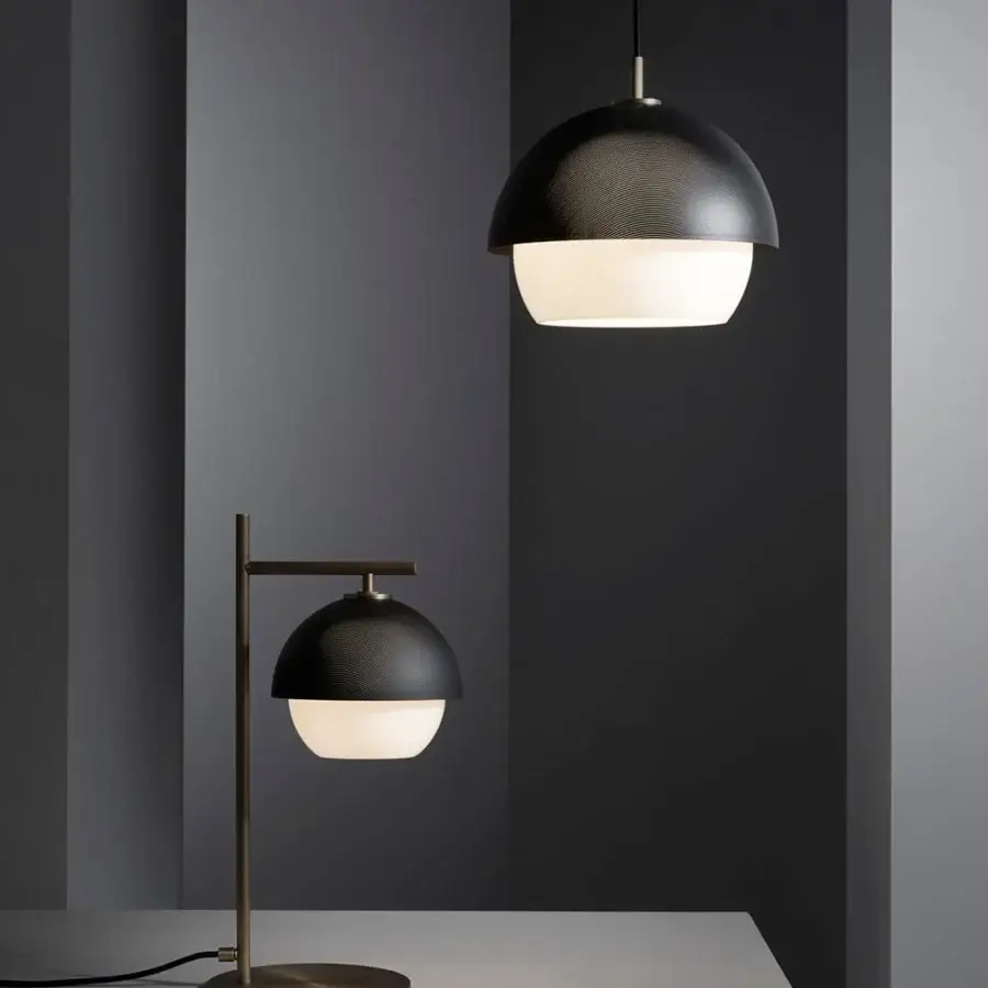 Elegant VENICEM Urban table lamp with burnished brass and a matt black perforated metal lampshade crafted in Italy