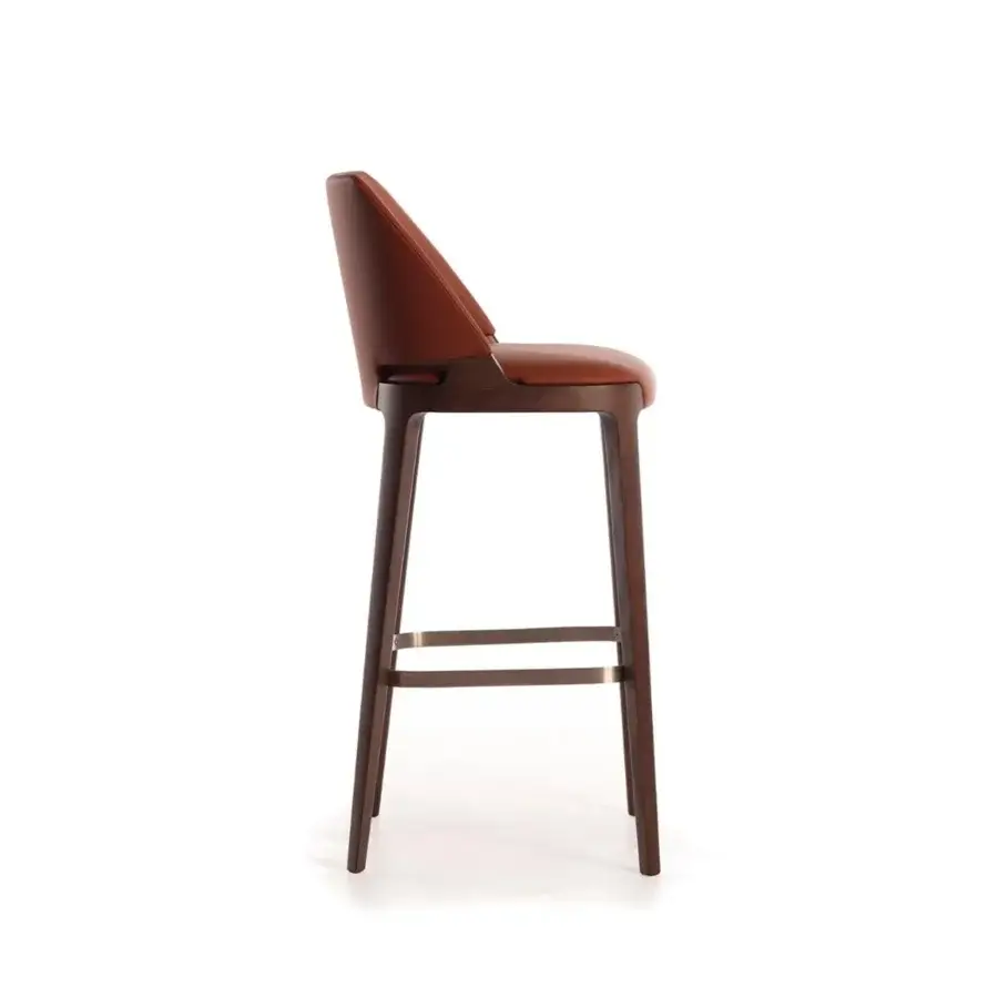 Distinguished Potocco Velis stool with ash legs and metal footrest, upholstered in reddish-brown, leather-like fire retardant polyurethane foam