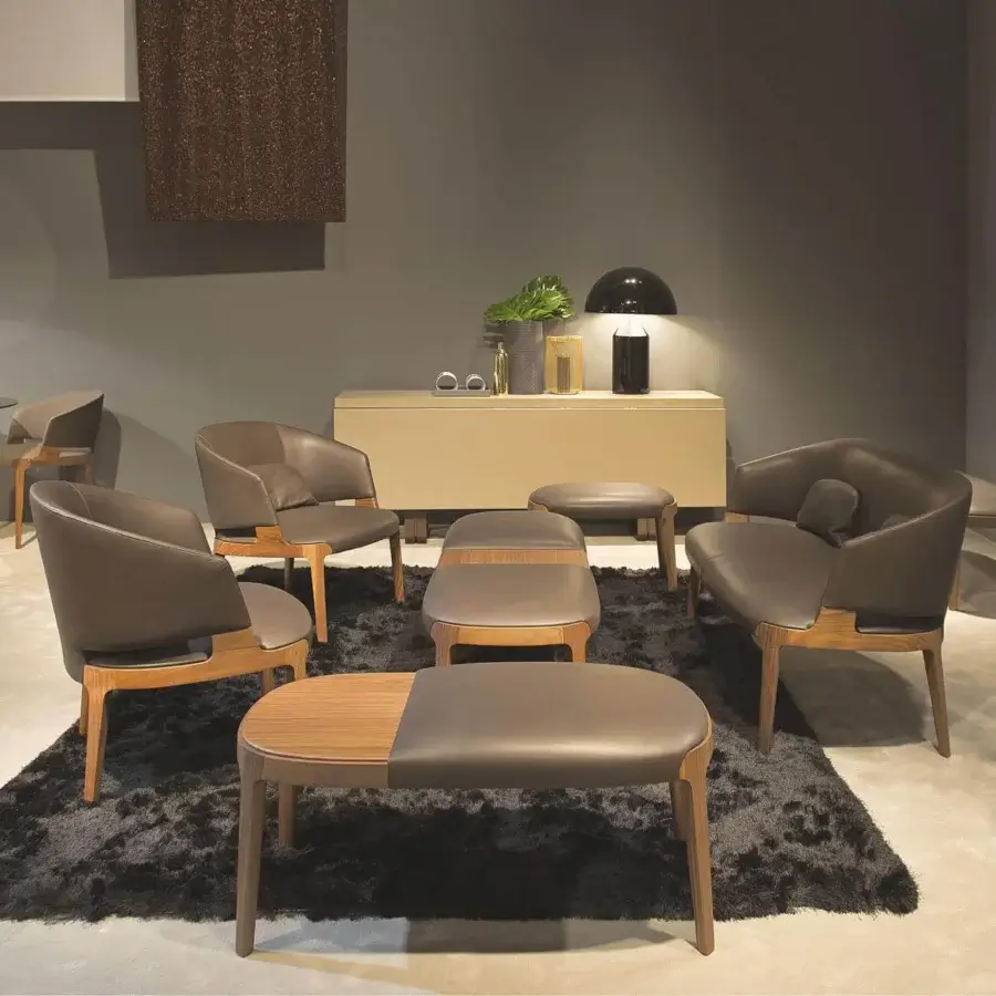 Superior Potocco Velis lounge chair with rich brown leather upholstery and a matte Canaletto walnut frame