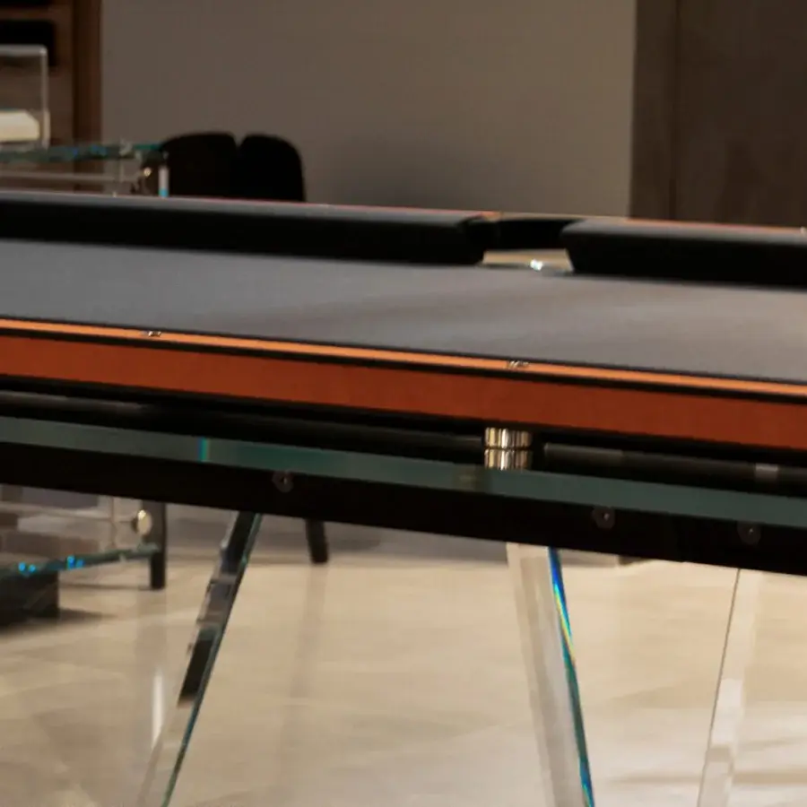 Exclusive Teckell Plano T 1.3 pool table with dark gray Alcantara® playing surface and crystal-clear tempered glass legs built with a matte black oak base