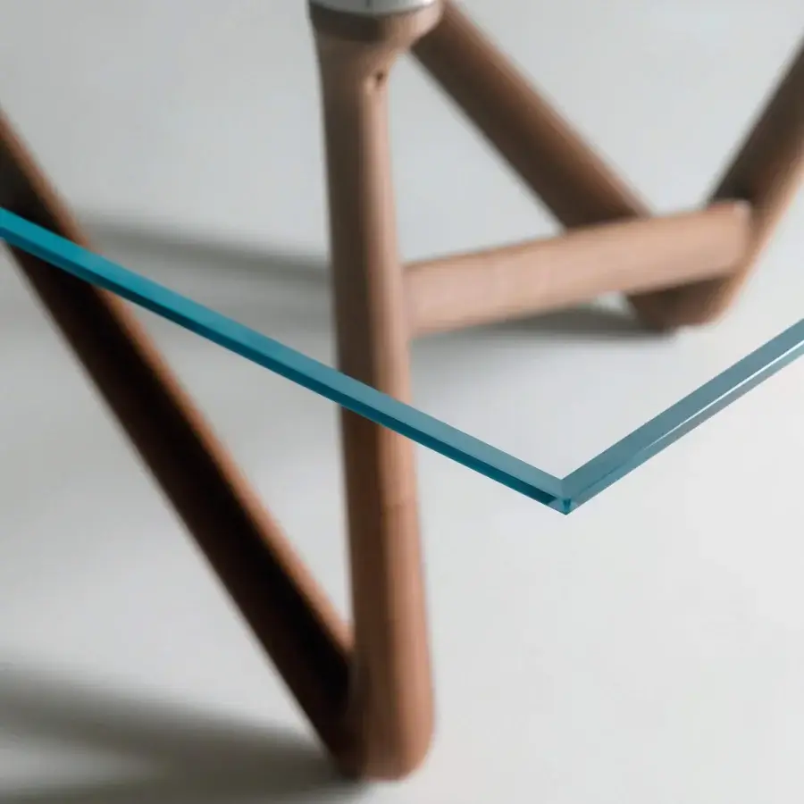 Distinguished Teckell Effetto 71 table with teal-blue tempered glass and solid Canaletto Walnut wood legs crafted in stainless steel joints