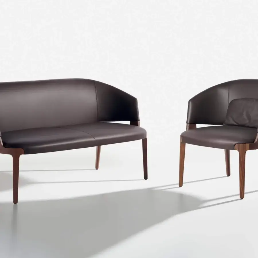 Superior Potocco Velis sofa with enveloping seat, Canaletto walnut legs and dark brown leather upholstery in satin finish
