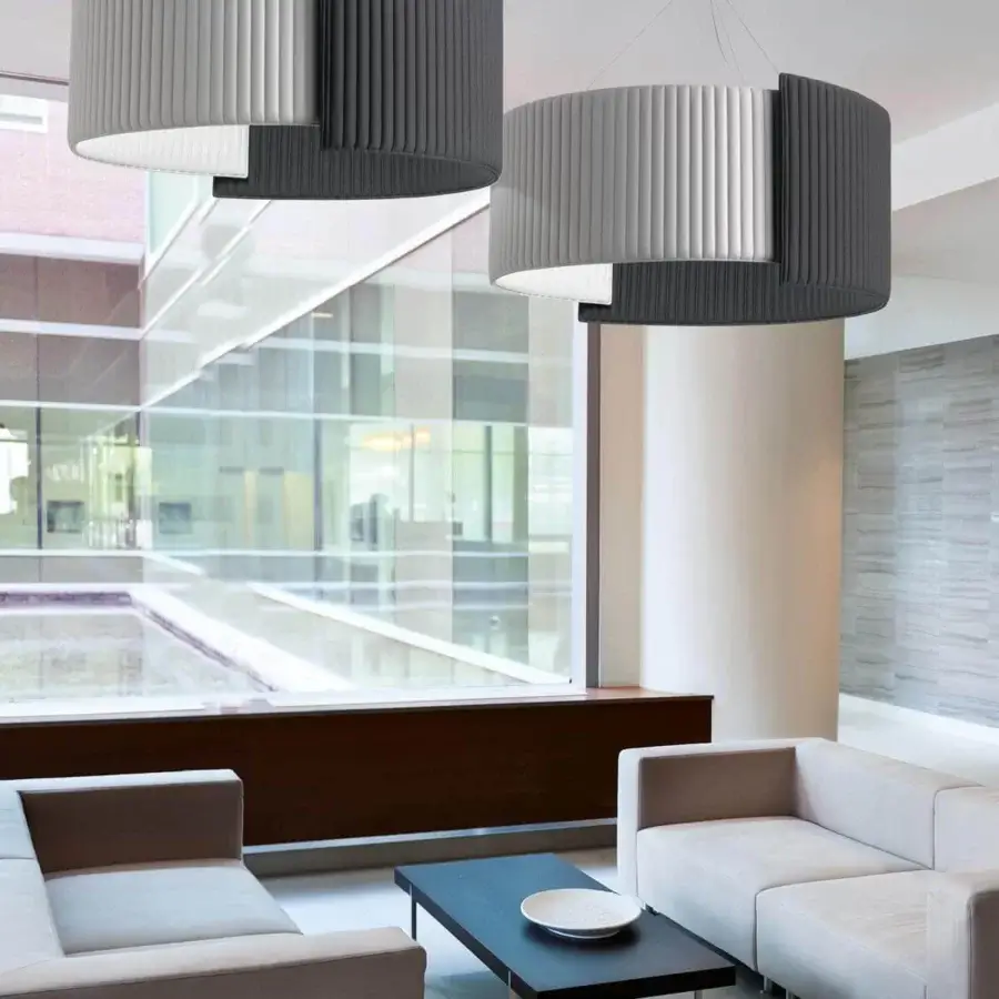 Exceptional Modo Luce Alco suspension lamp with cylindrical form upholstered in light and darker gray stitched fabric and matte finish