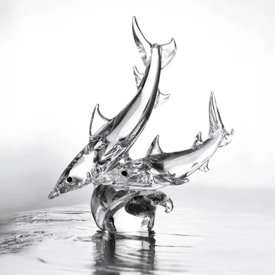 Glass shark sculpture, clear material, dynamic leaping composition on dark base, minimalist modern art, subtle refractions.