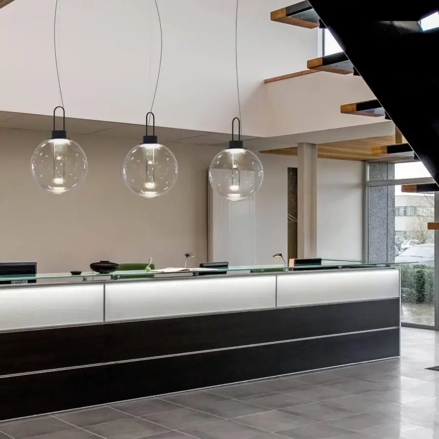 Distinguished Modo Luce Orb suspension lamp with transparent smoked PMMA shade and sleek black painted metal structure