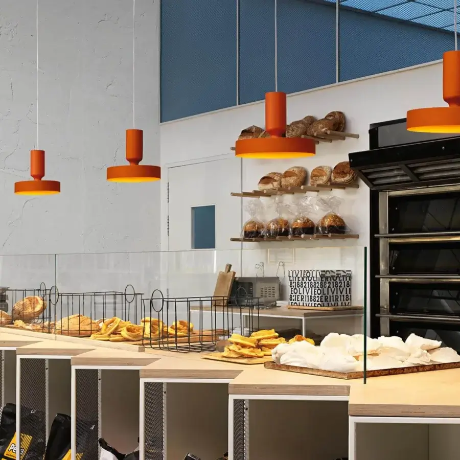 Superior Modo Luce Hammer suspension lamp with minimalist design in smooth matte orange finish and dynamic cylindrical shapes