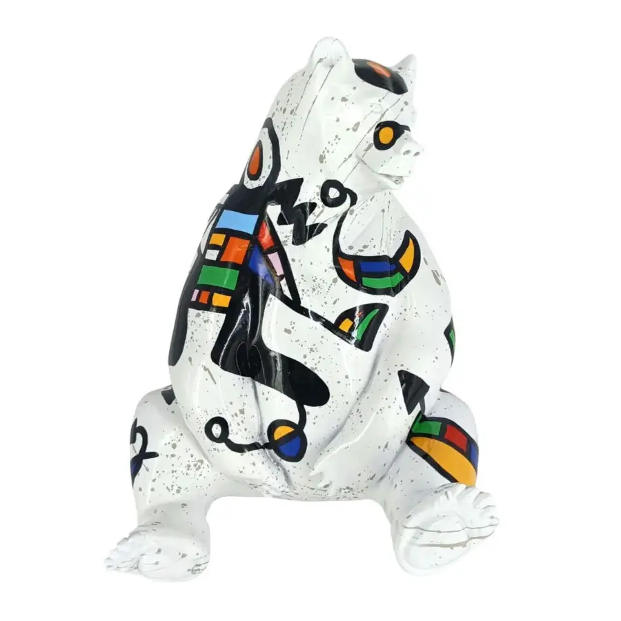 Seated bear sculpture, white ceramic, abstract Miro-style painting in black, red, yellow, blue, and green with geometric and organic shapes.