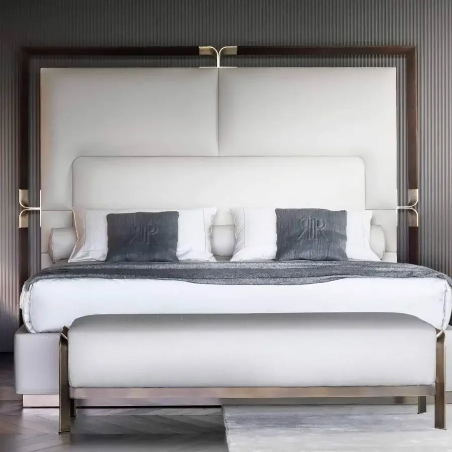Lavish Rugiano Grace bed with a tall leather headboard and refined bronze details, crafted in Italy