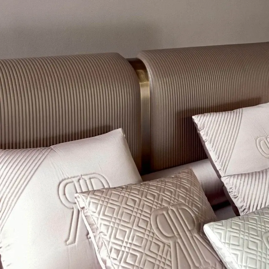 Superior Rugiano Vogue bed with vertically ribbed matte beige fabric upholstery and steel finish metal detailing
