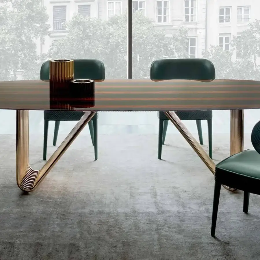 Captivating Rugiano Alyson table with curved light gold metal tubes and dark brown striped wood-like surface exhibiting Italian craftsmanship