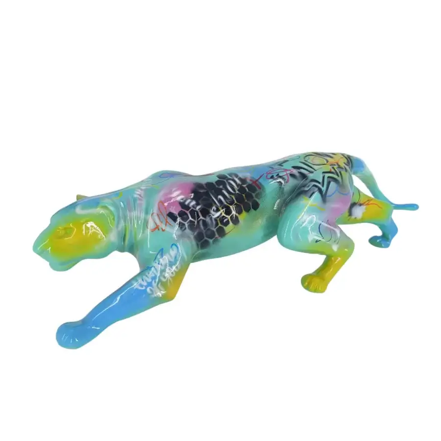 Panther sculpture, teal and multi-colored, dynamic pose with graffiti-style markings and glossy finish by Juliarte.