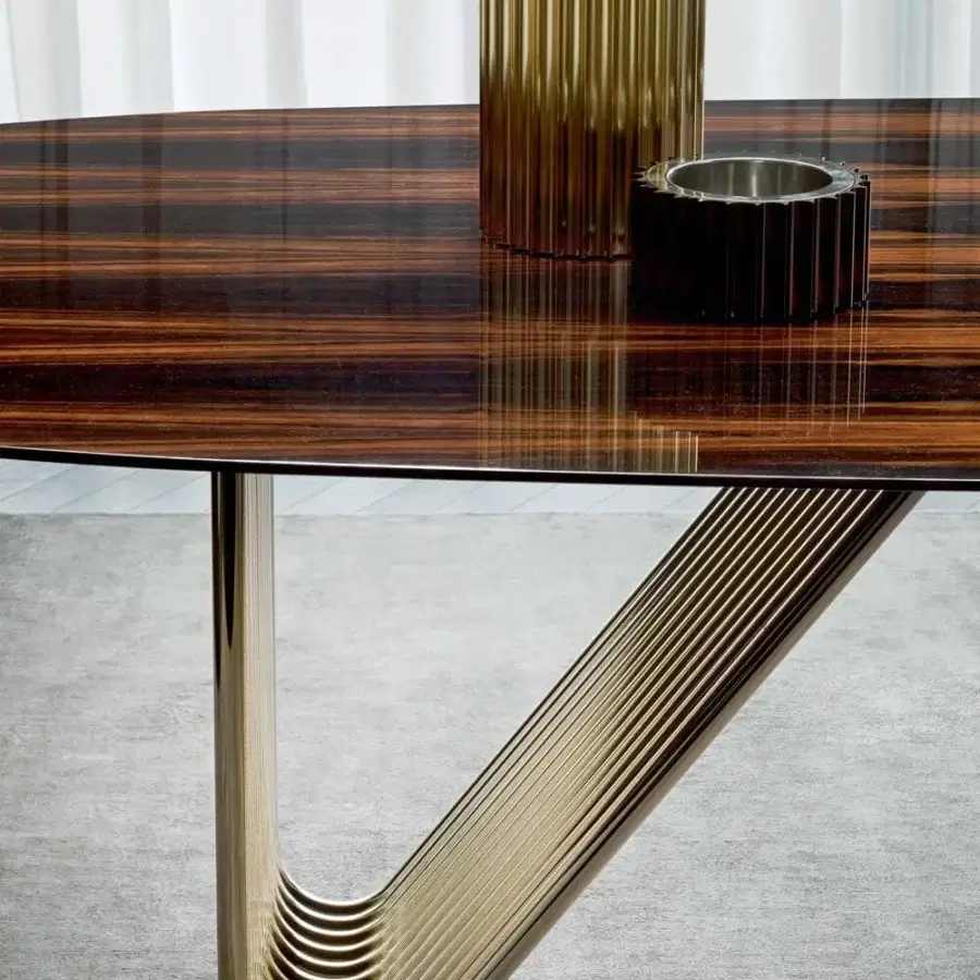 Distinguished Rugiano Alyson table crafted with curved light gold metal tubes and glossy dark brown wood exhibiting horizontal grain