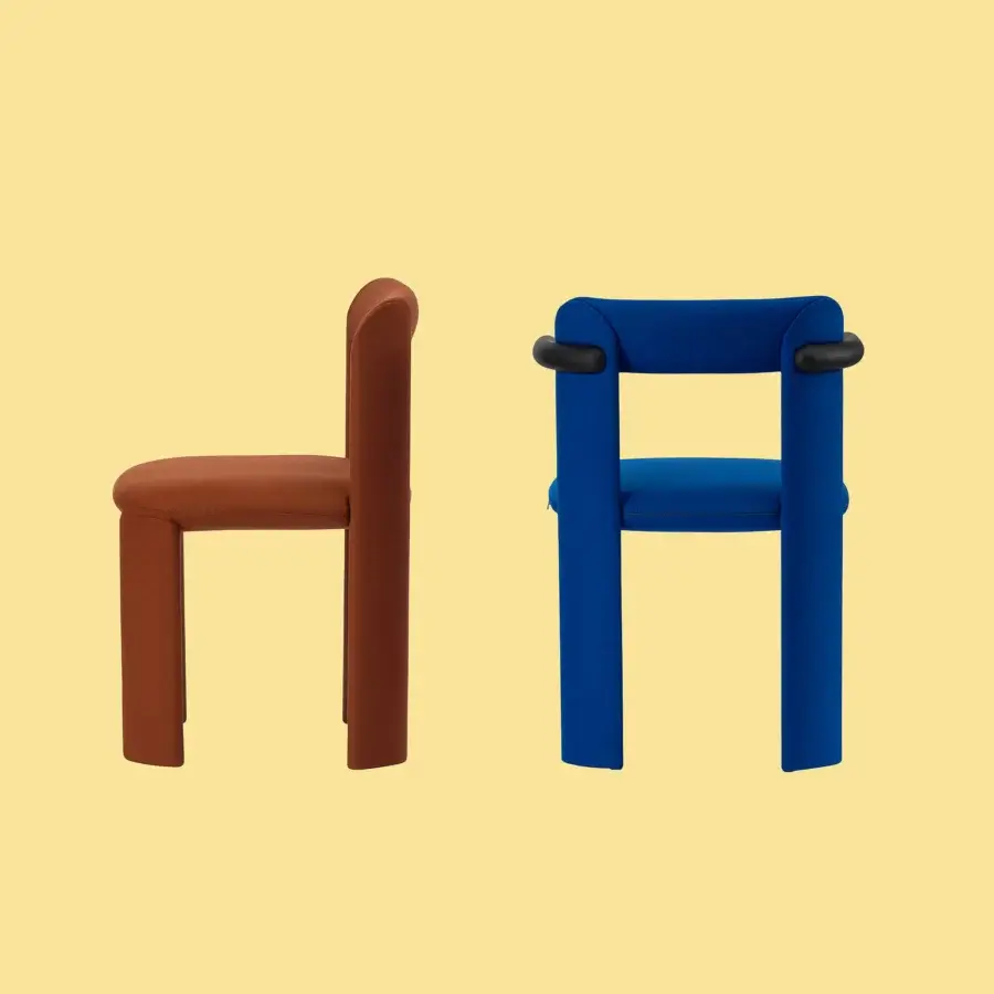Sophisticated Miniforms Amia chair upholstered in blue fabric with a matte finish textile and uniquely crossed legs